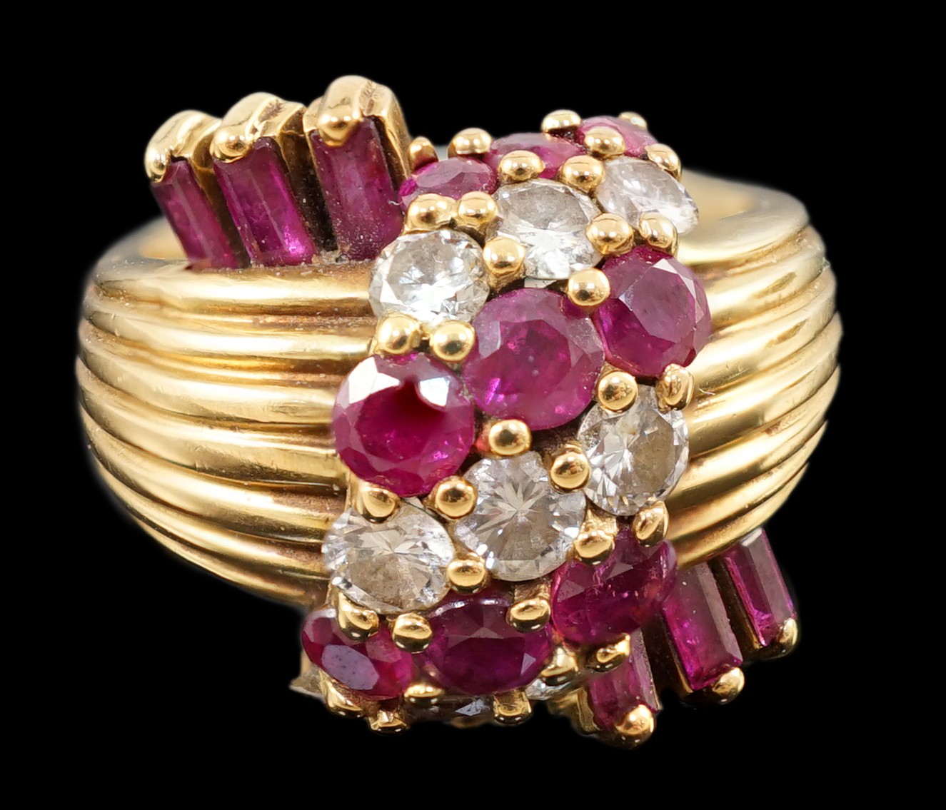 An early 1960's Kutchinsky 18ct gold ruby and diamond cluster set dress ring